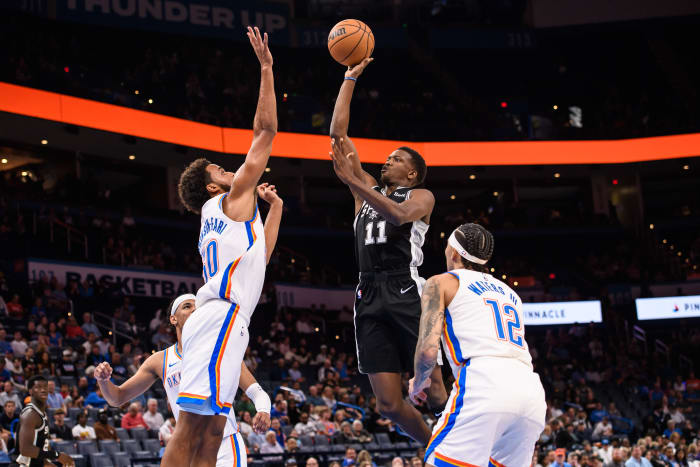 San Antonio Spurs guard Sir'Jabari Rice (11) shoots the ball while defended by Oklahoma City Thunder forward Jeremiah Robinson-Earl (50) during the second half at Paycom Center.
